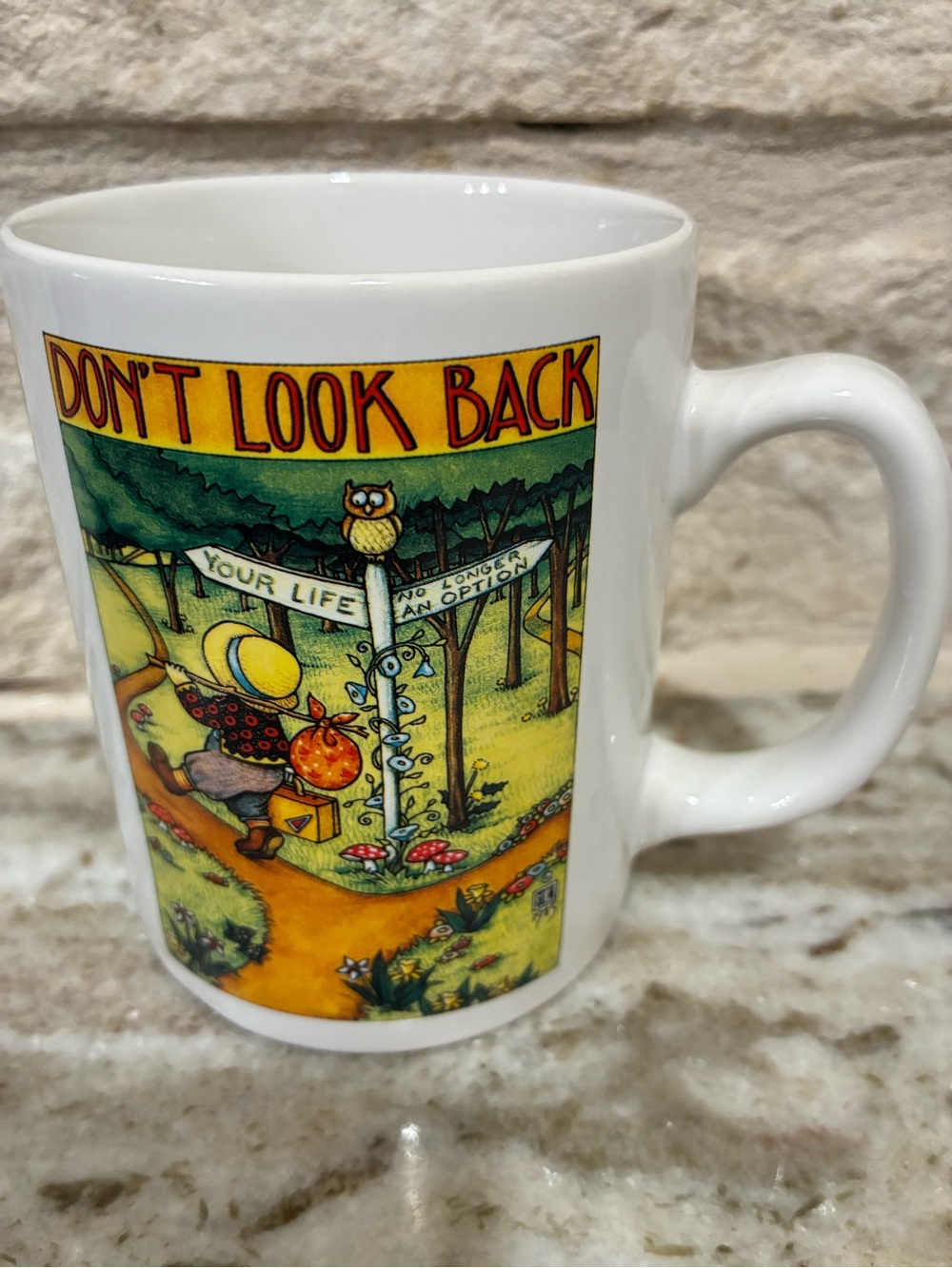 Mary Engelbreit Don't Look Back White Ceramic Mug with Colorful Illustration